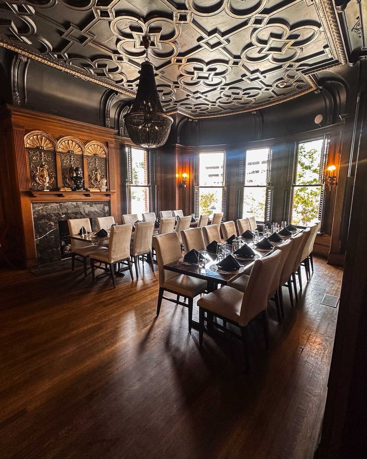 Salon 1 at Union Ave — carved ceiling, long table and fireplace